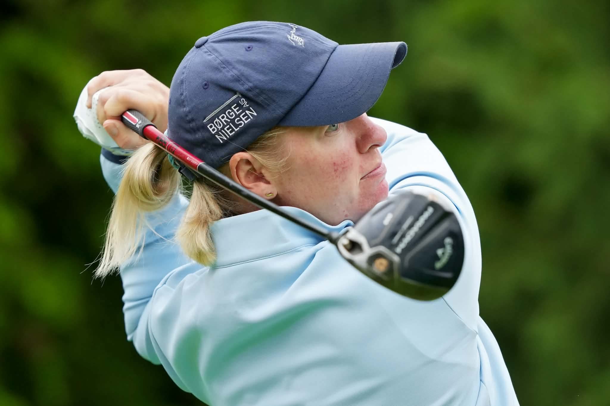 Nicole playing golf
